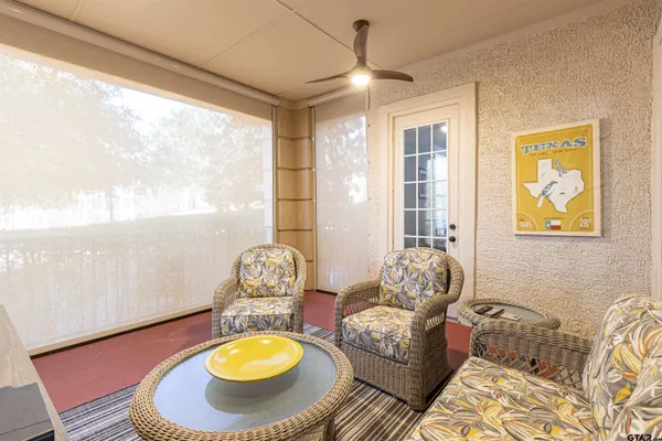 a living room with furniture and a window
