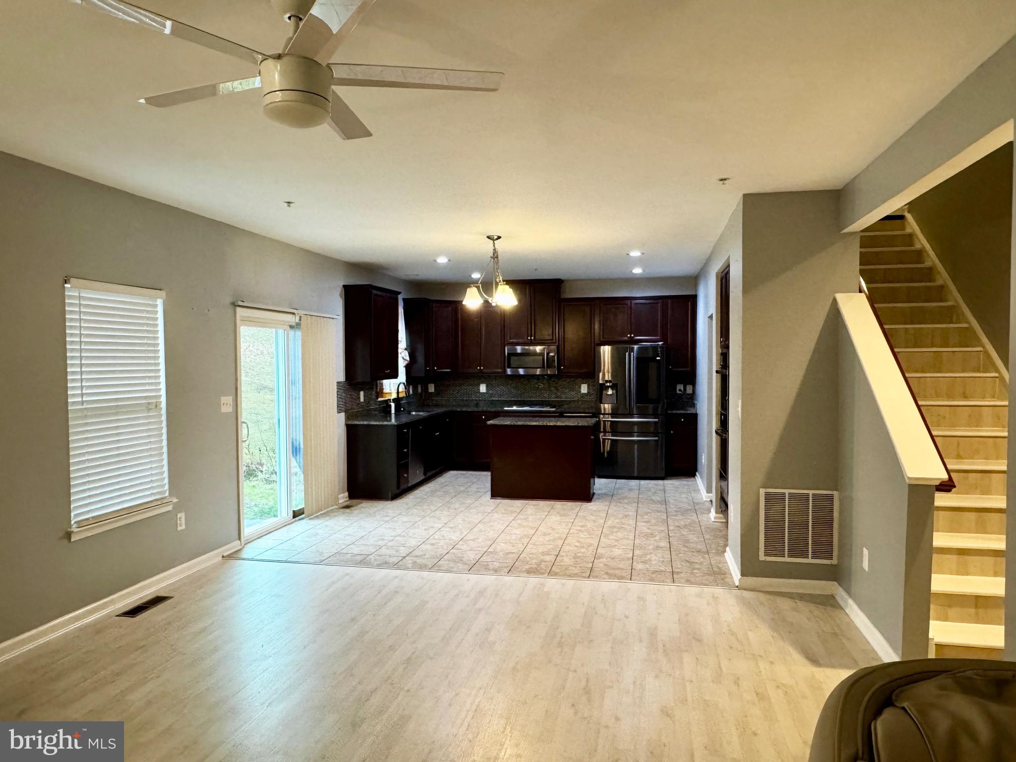 2223 Argonne Drive Havre de Grace, MD 21078 - Photo 12 of 29 a view of a kitchen with kitchen island stainless steel appliances wooden floor and window