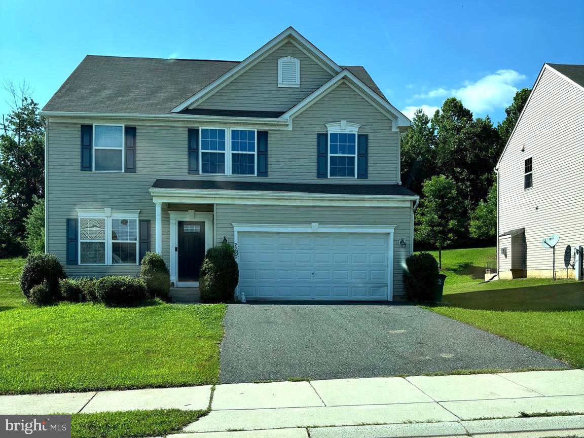 2223 Argonne Drive Havre de Grace, MD 21078 - Photo 17 of 29 a front view of a house with a yard and garage
