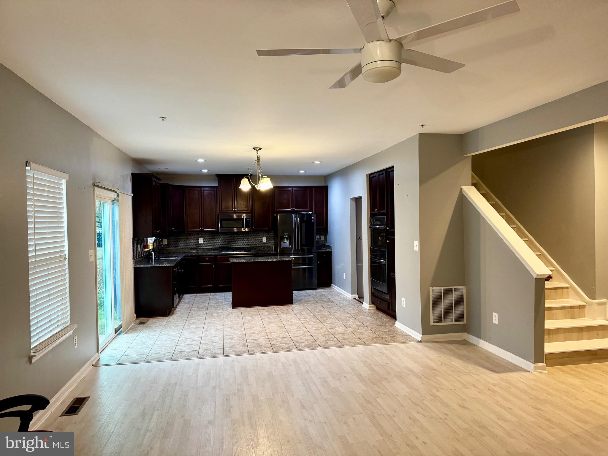 2223 Argonne Drive Havre de Grace, MD 21078 - Photo 2 of 29 a large kitchen with a sink and dishwasher a stove top oven with wooden floor