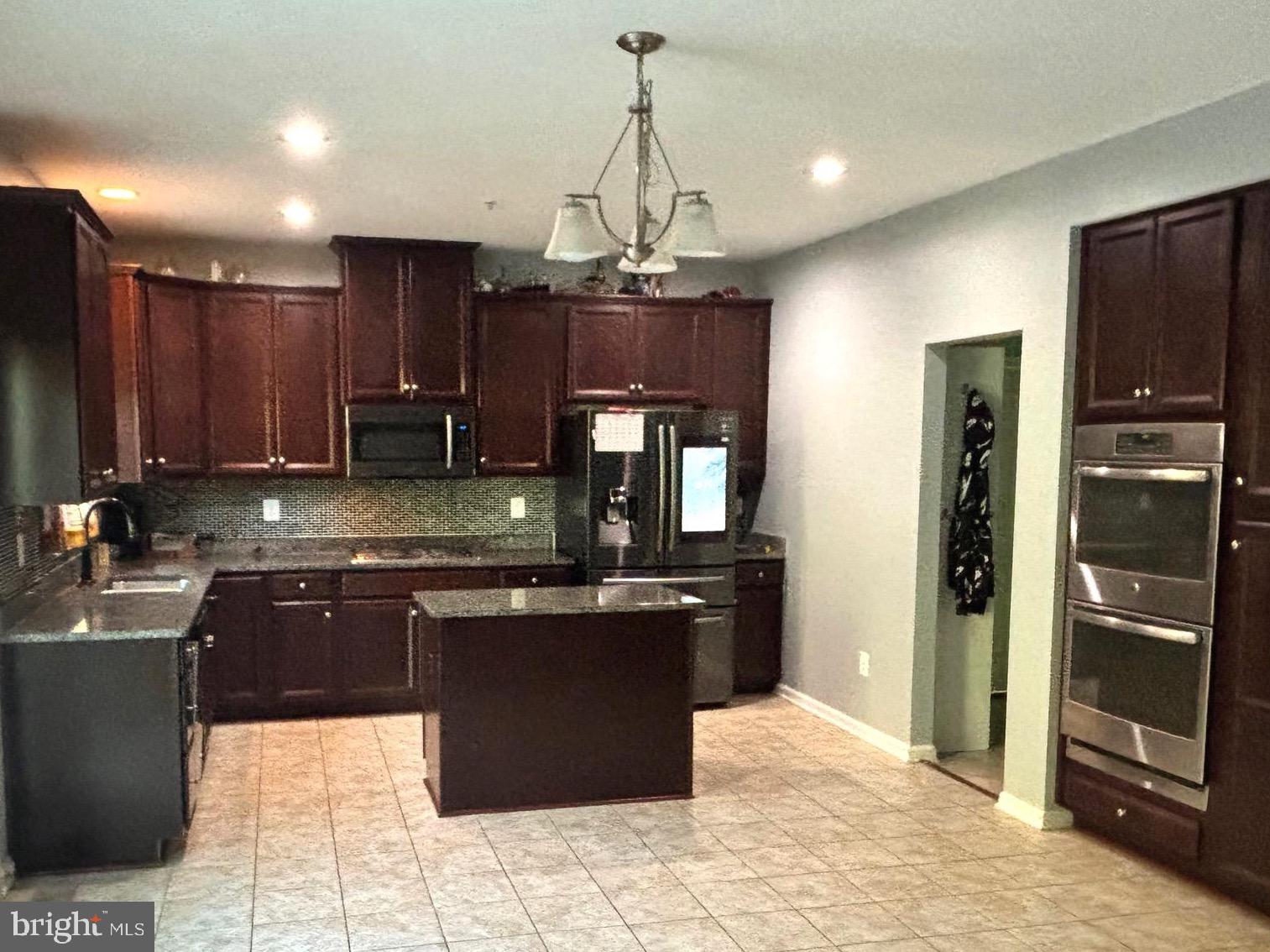 2223 Argonne Drive Havre de Grace, MD 21078 - Photo 3 of 29 a kitchen with stainless steel appliances granite countertop a stove refrigerator and a sink