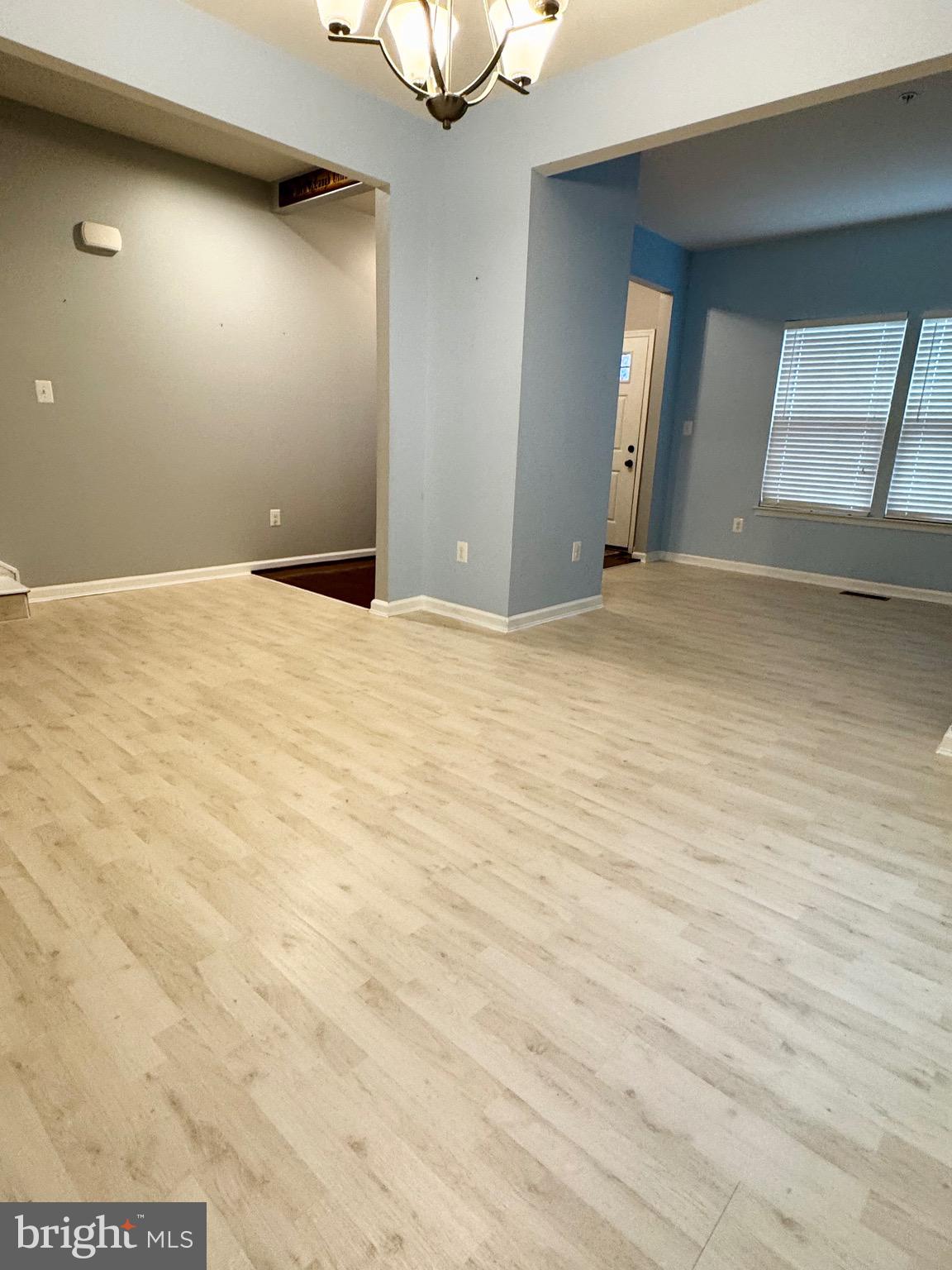 2223 Argonne Drive Havre de Grace, MD 21078 - Photo 5 of 29 a view of an empty room with wooden floor and a window