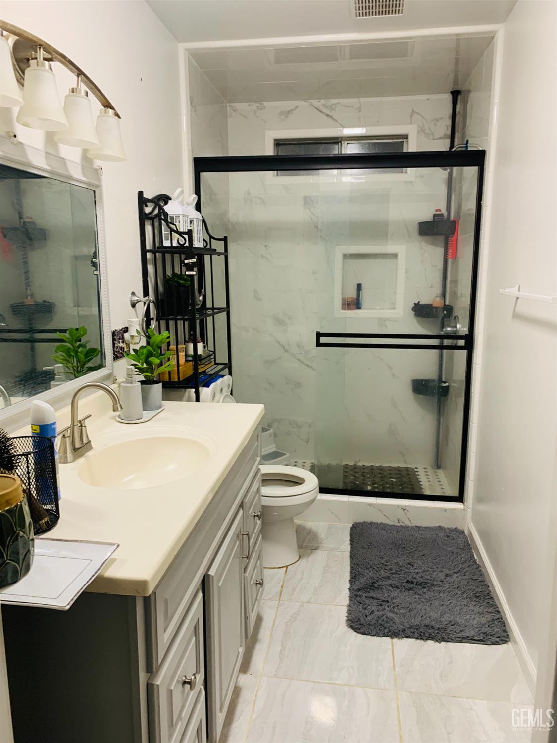 Undisclosed Address Delano, CA 93215 - Photo 13 of 14 a bathroom with a sink toilet and shower