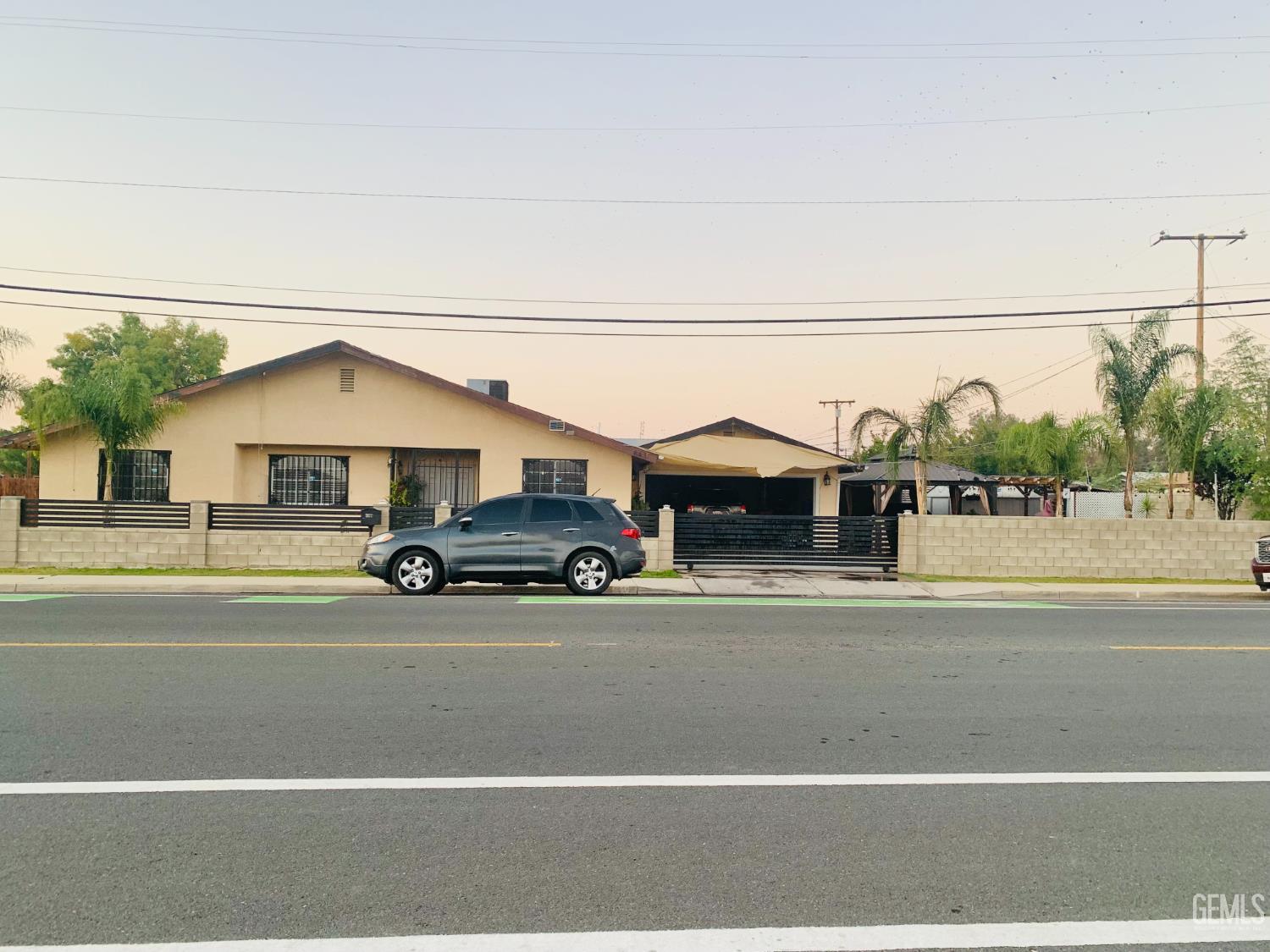 Undisclosed Address Delano, CA 93215 - Photo 14 of 14 a view of a car parked in front of a building