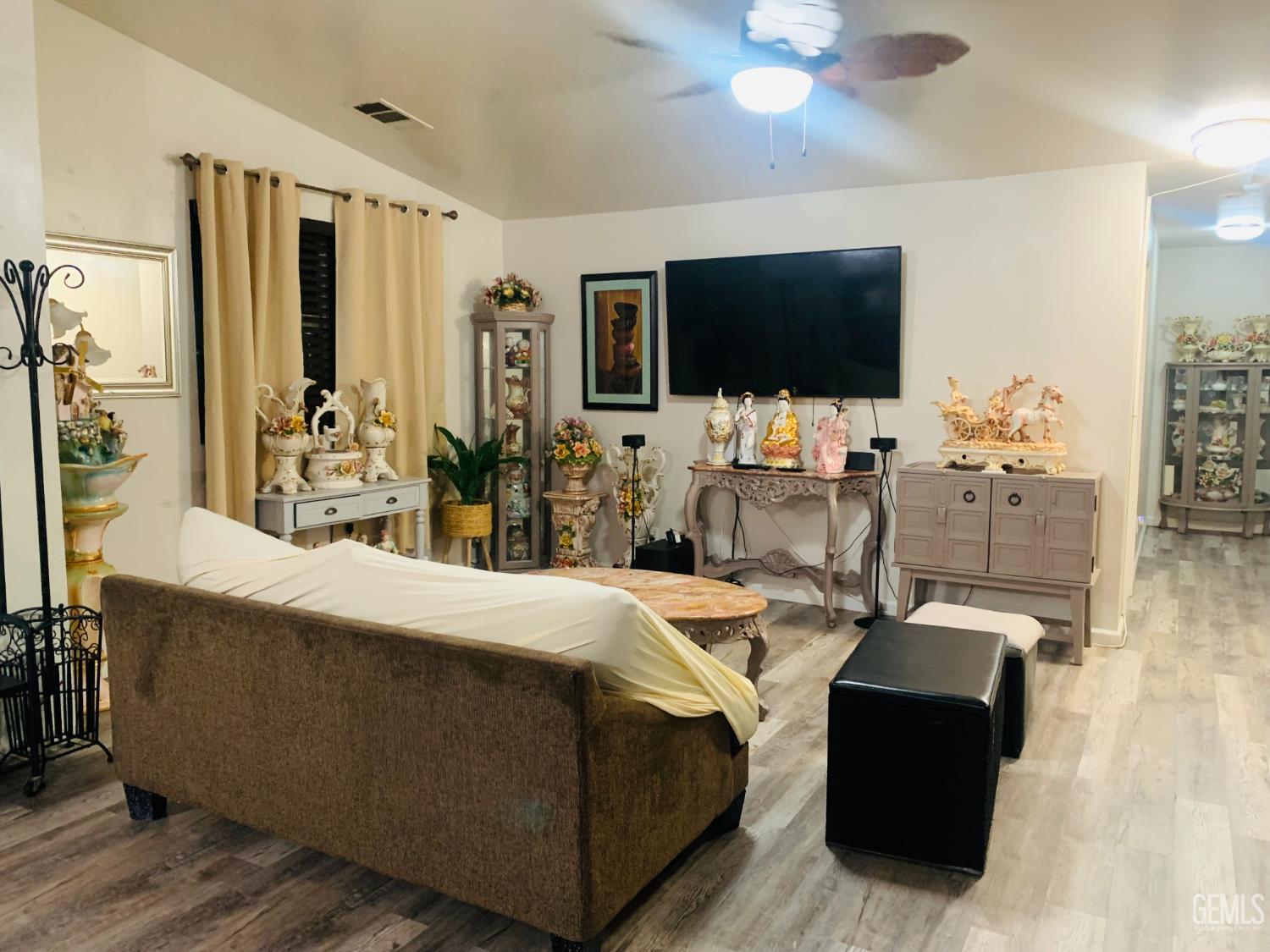 Undisclosed Address Delano, CA 93215 - Photo 5 of 14 a living room with furniture and a flat screen tv