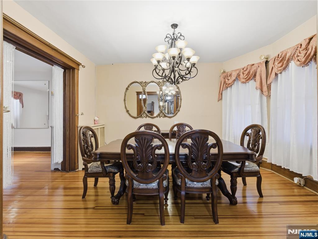 768 East 25th Street Paterson, NJ 07504 - Photo 12 of 29 a view of a dining room with furniture and chandelier