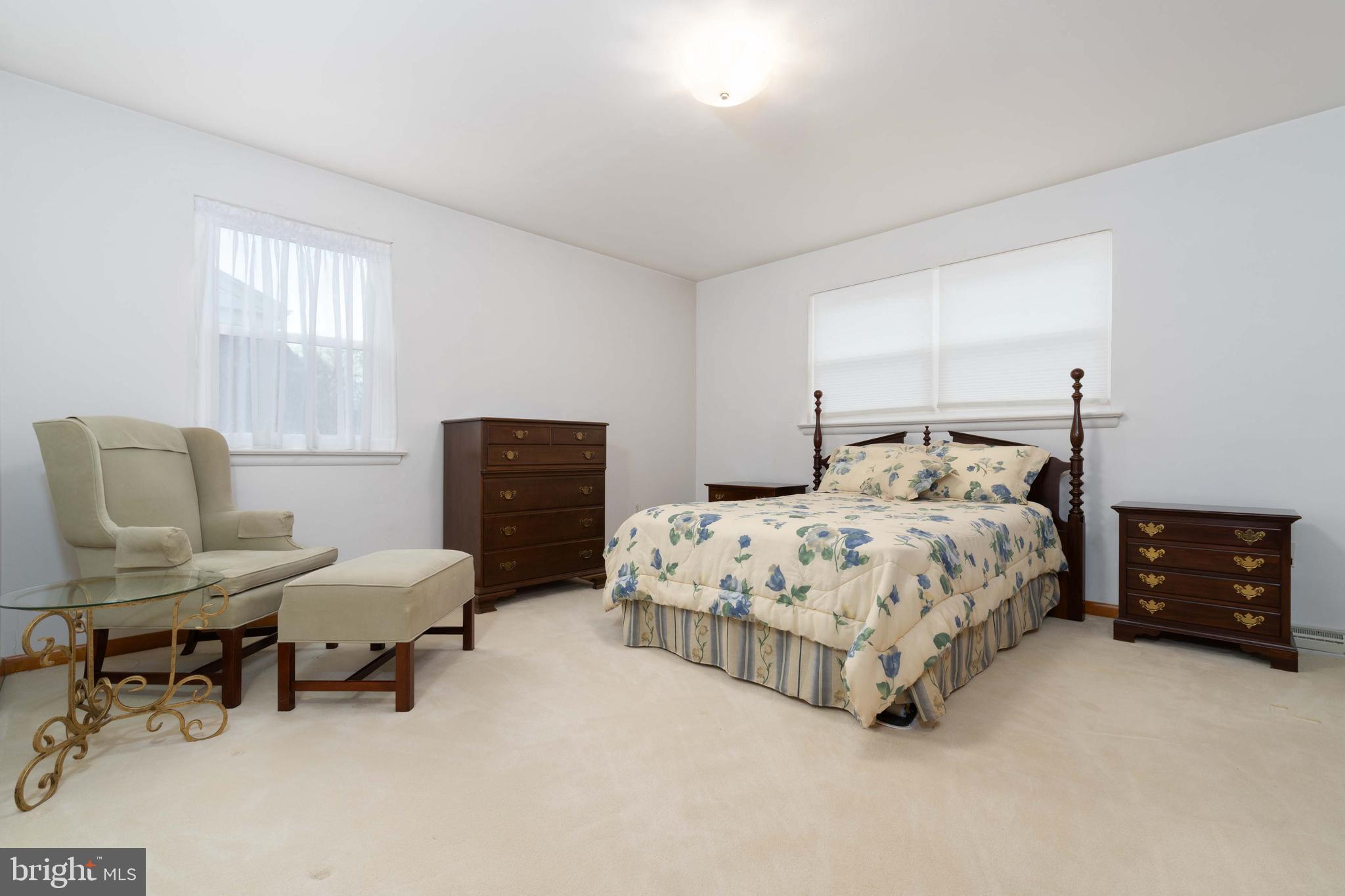 3881 Elder Road Harrisburg, PA 17111 - Photo 16 of 34 a bedroom with a bed and chair