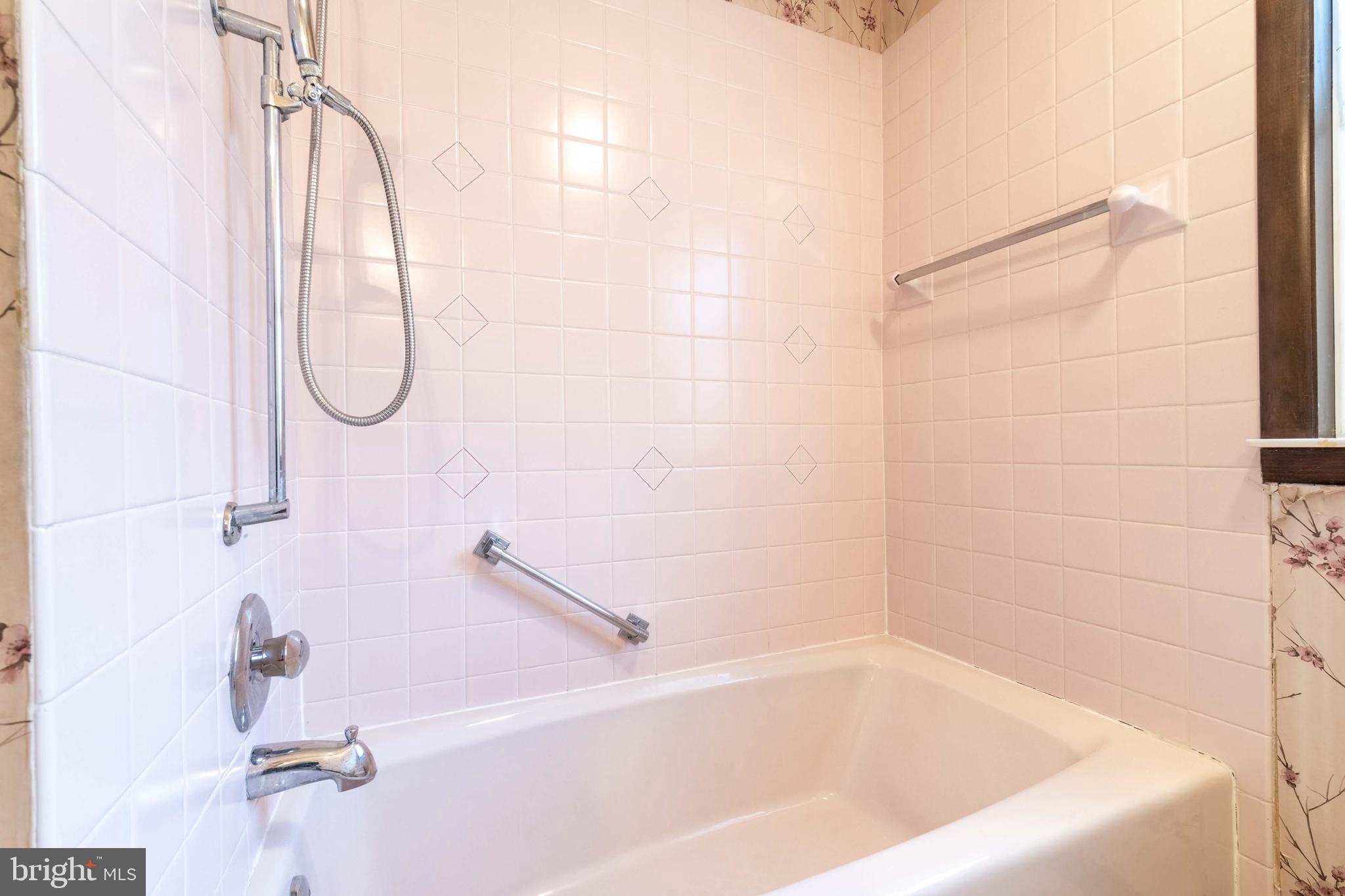 3881 Elder Road Harrisburg, PA 17111 - Photo 19 of 34 a bathroom with a bath tub with a shower