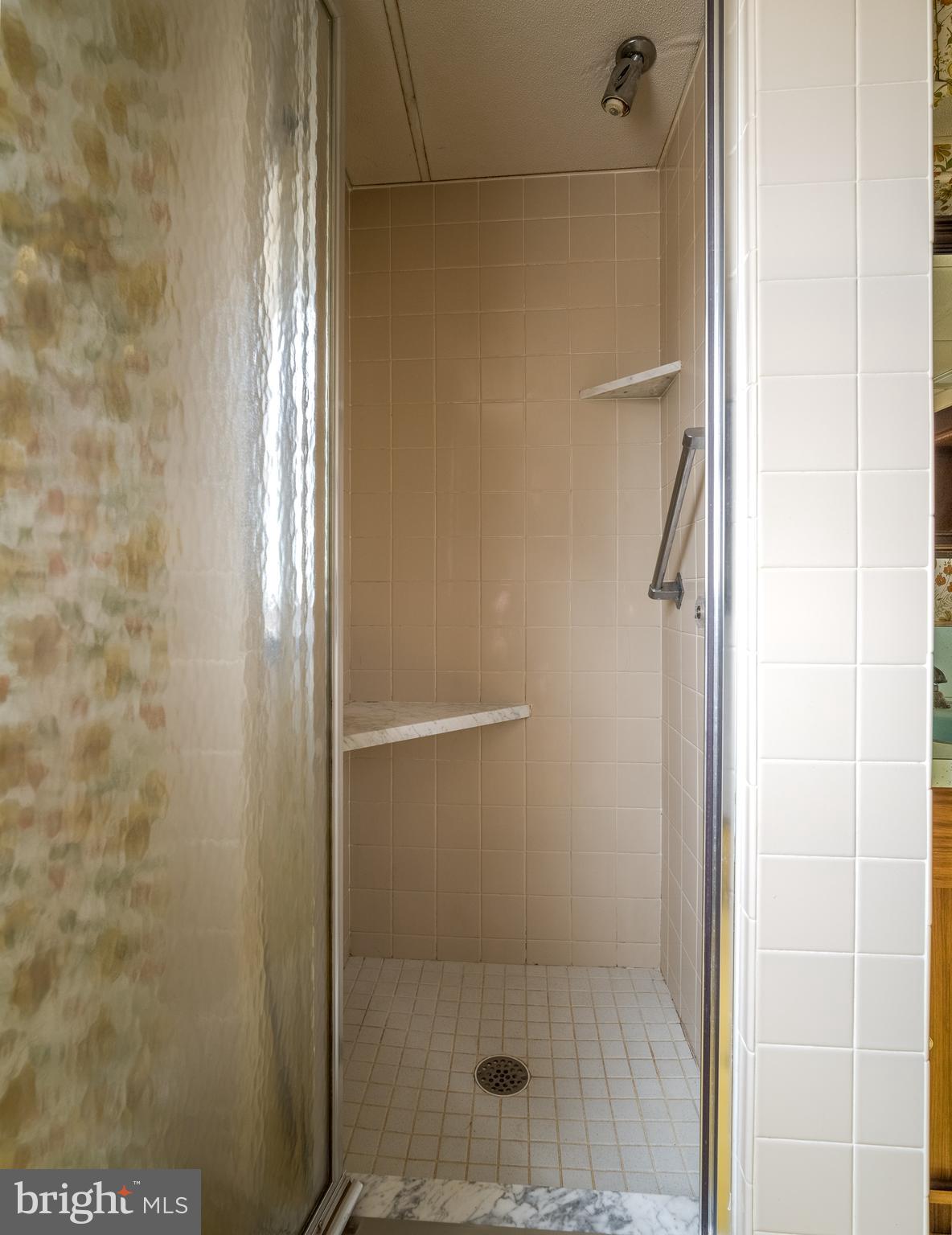 3881 Elder Road Harrisburg, PA 17111 - Photo 33 of 34 a bathroom with a glass shower door