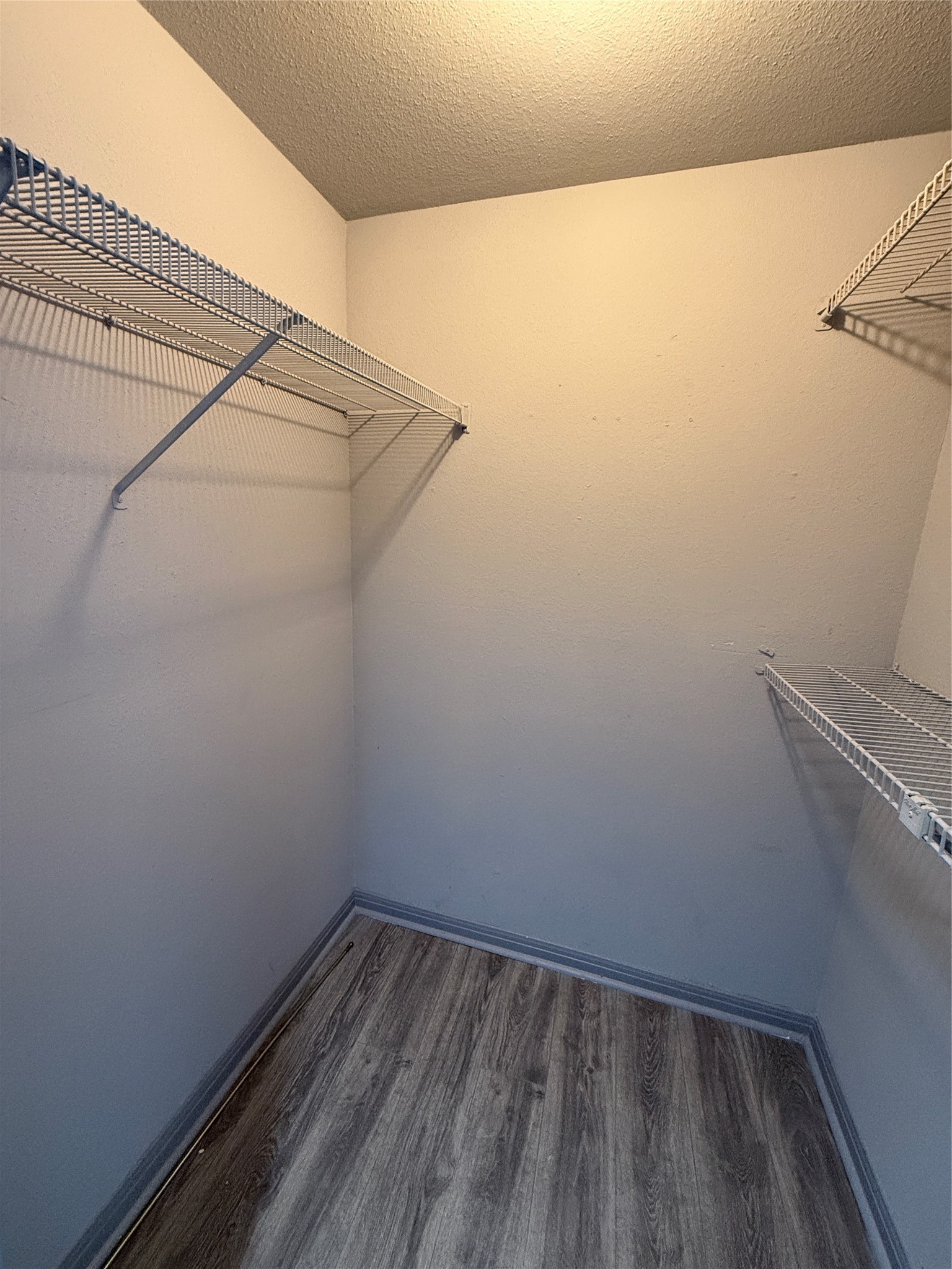 12200 Overbrook Lane, Unit 34D Houston, TX 77077 - Photo 17 of 19 a view of a room with racks on the wall