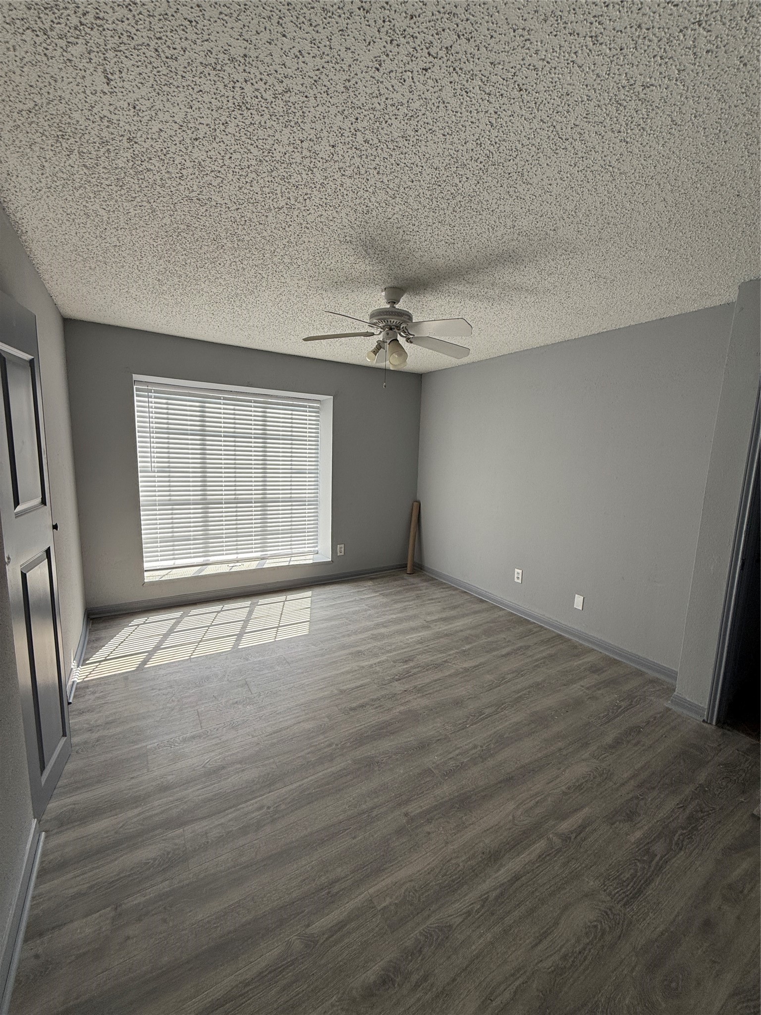 12200 Overbrook Lane, Unit 34D Houston, TX 77077 - Photo 18 of 19 an empty room with wooden floor and windows