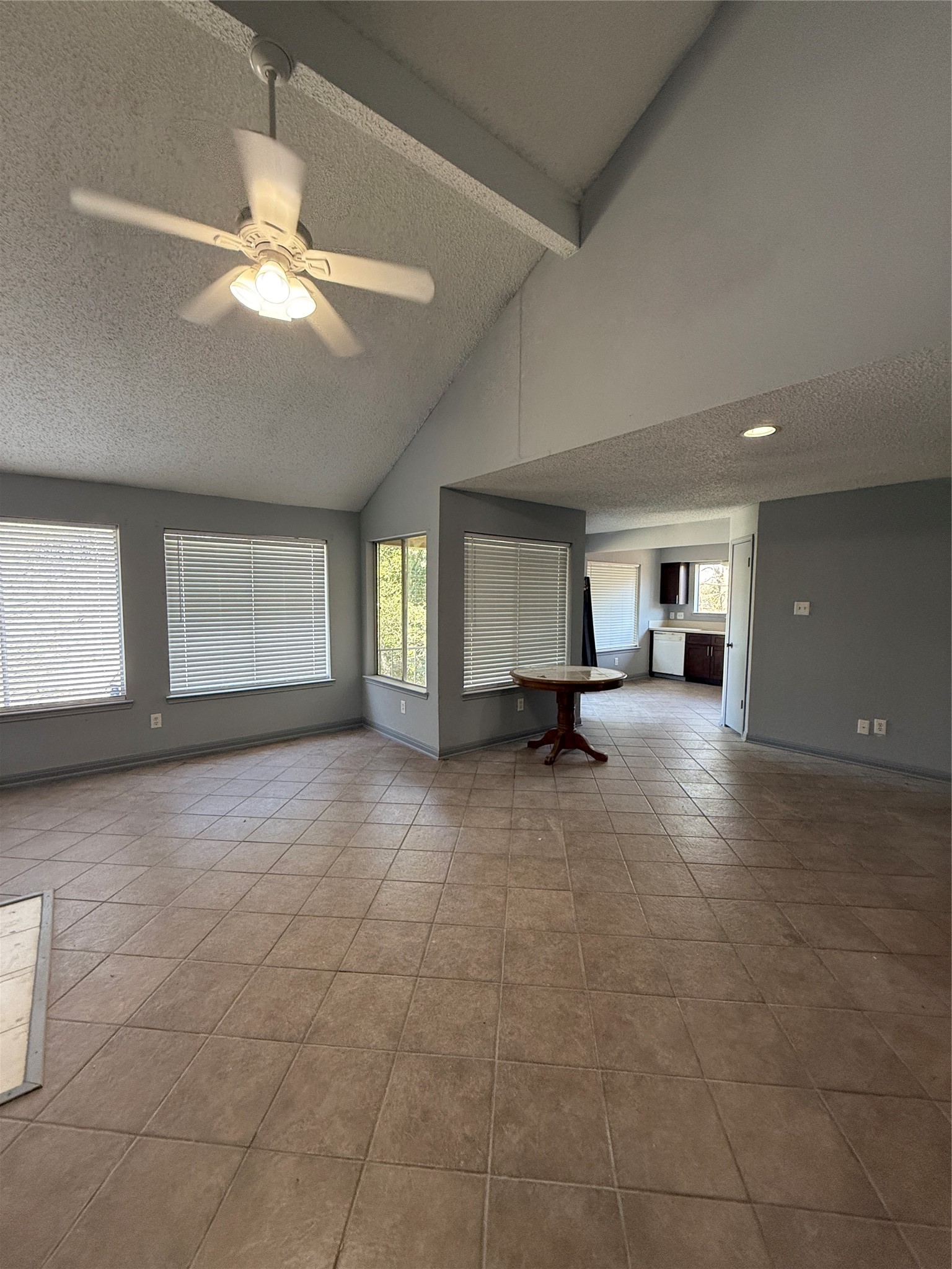 12200 Overbrook Lane, Unit 34D Houston, TX 77077 - Photo 6 of 19 a view of a livingroom with a ceiling fan and window