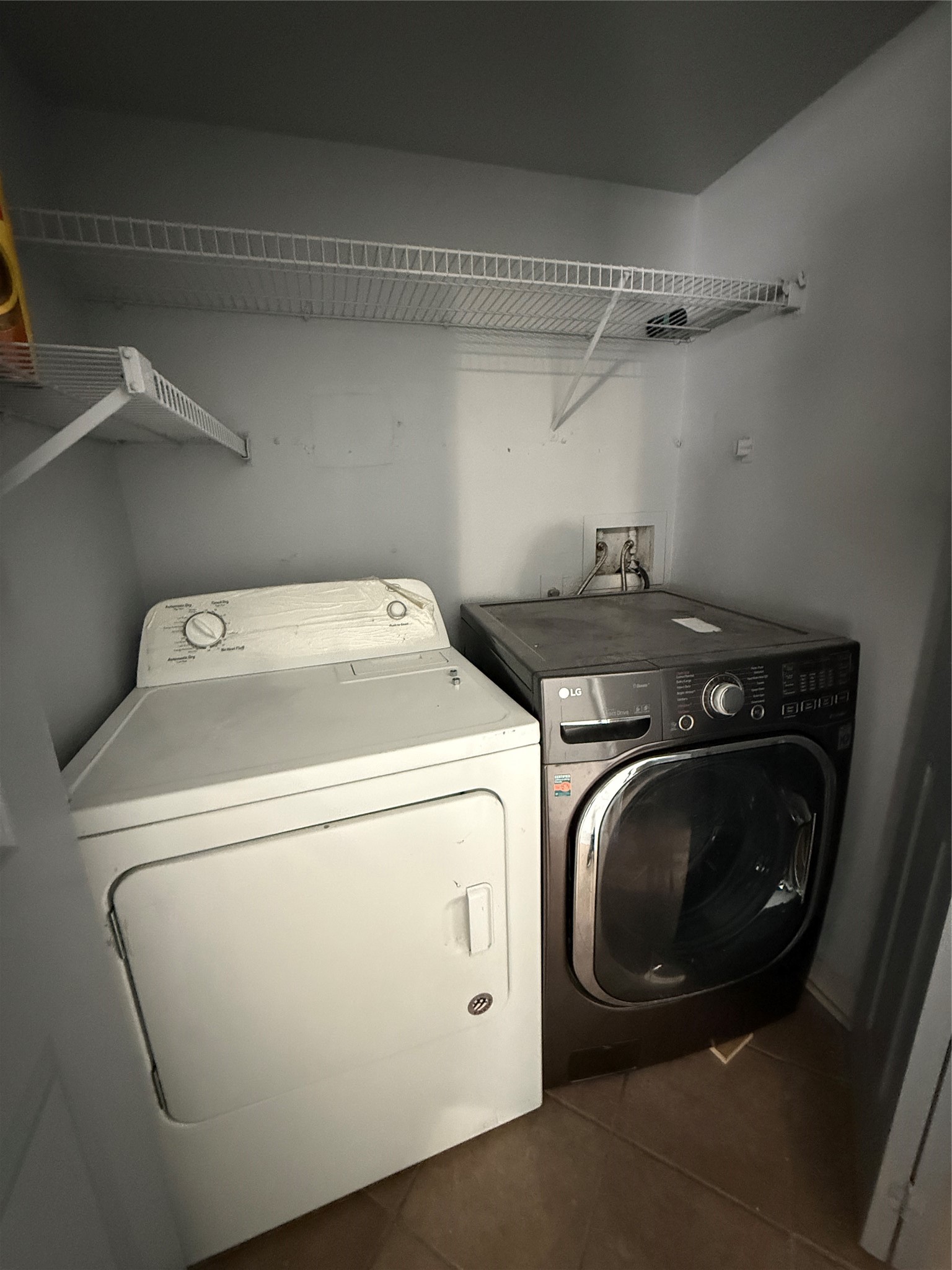 12200 Overbrook Lane, Unit 34D Houston, TX 77077 - Photo 9 of 19 a utility room with dryer and washer