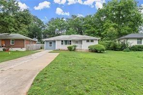 2756 Gresham Rd S East Atlanta, GA 30316 - Photo 3 of 32 a front view of a house with a yard