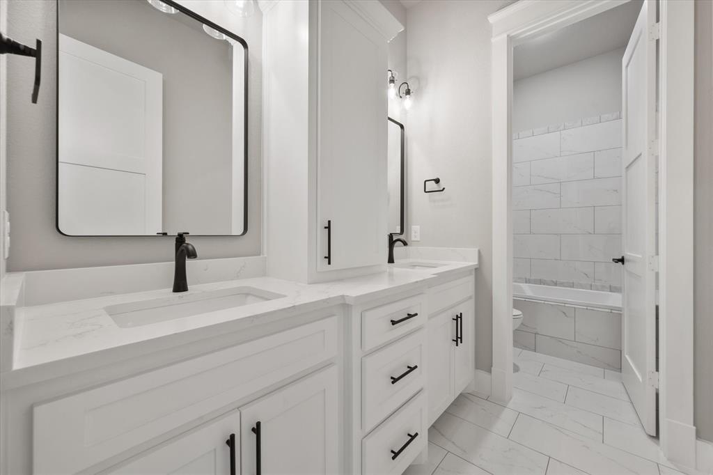 6610 Waggoner Way Midlothian, TX 76065 - Photo 35 of 40 Dual vanity with integrated sinks and white countertops