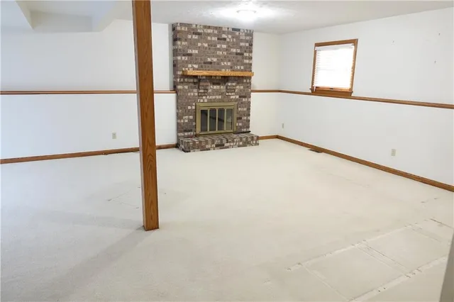 a view of an empty room with glass door