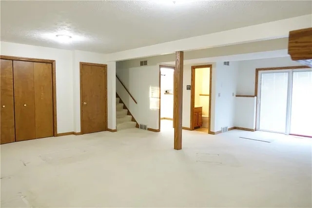 a view of a patio with table and chairs and potted plants