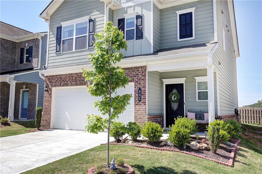 402 Perth Drive Cartersville, GA 30121 - Photo 29 of 31 a front view of a house with garden