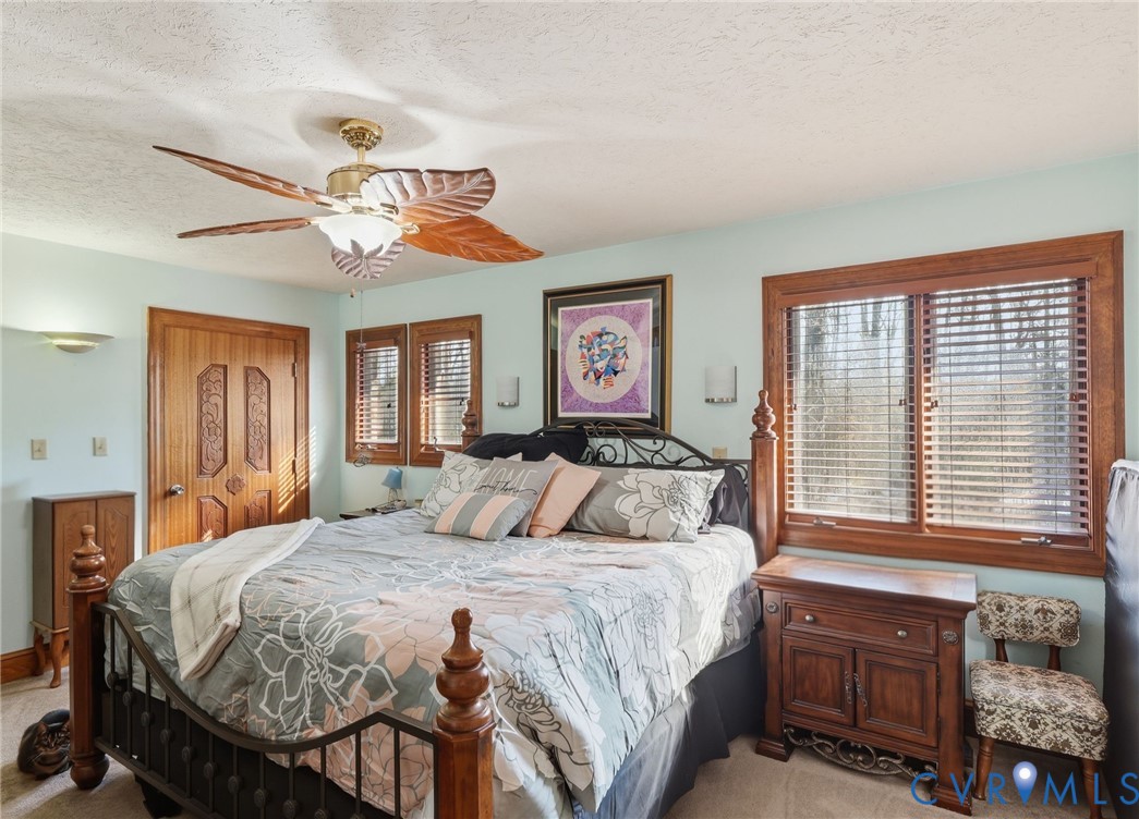 8416 Arnold Road Mechanicsville, VA 23111 - Photo 25 of 58 Primary bedroom with ceiling fan, double closets a