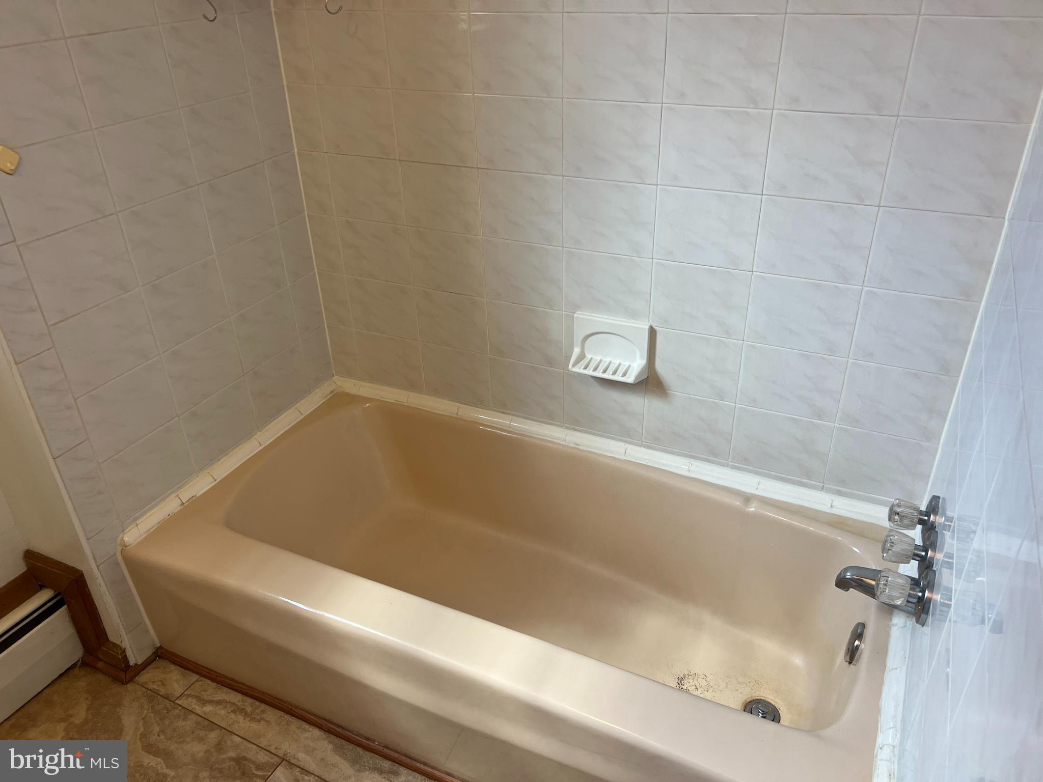 132 Main Street Mantua, NJ 08051 - Photo 12 of 15 a bathroom with a bathtub