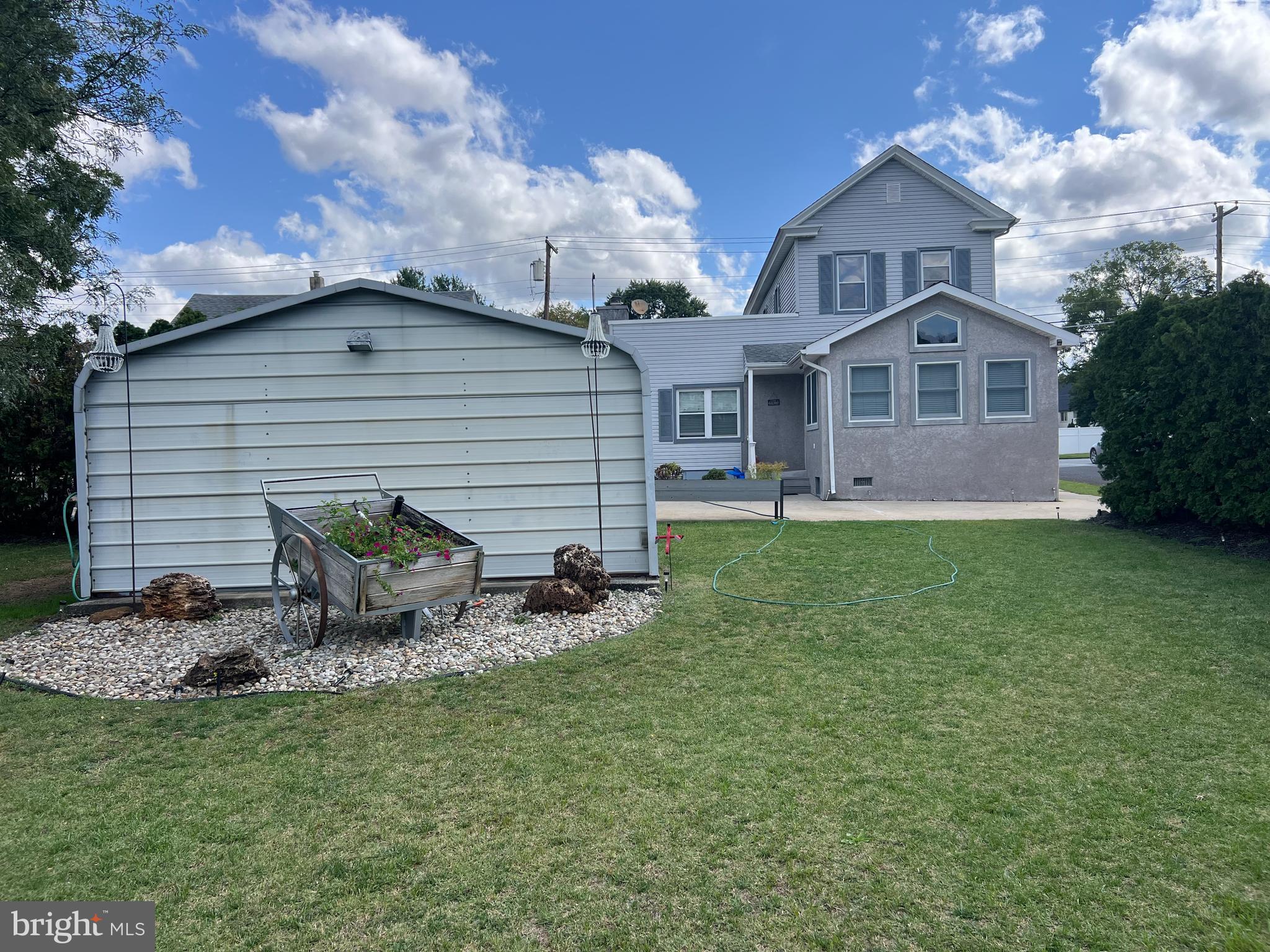 132 Main Street Mantua, NJ 08051 - Photo 15 of 15 a backyard of a house with table and chairs