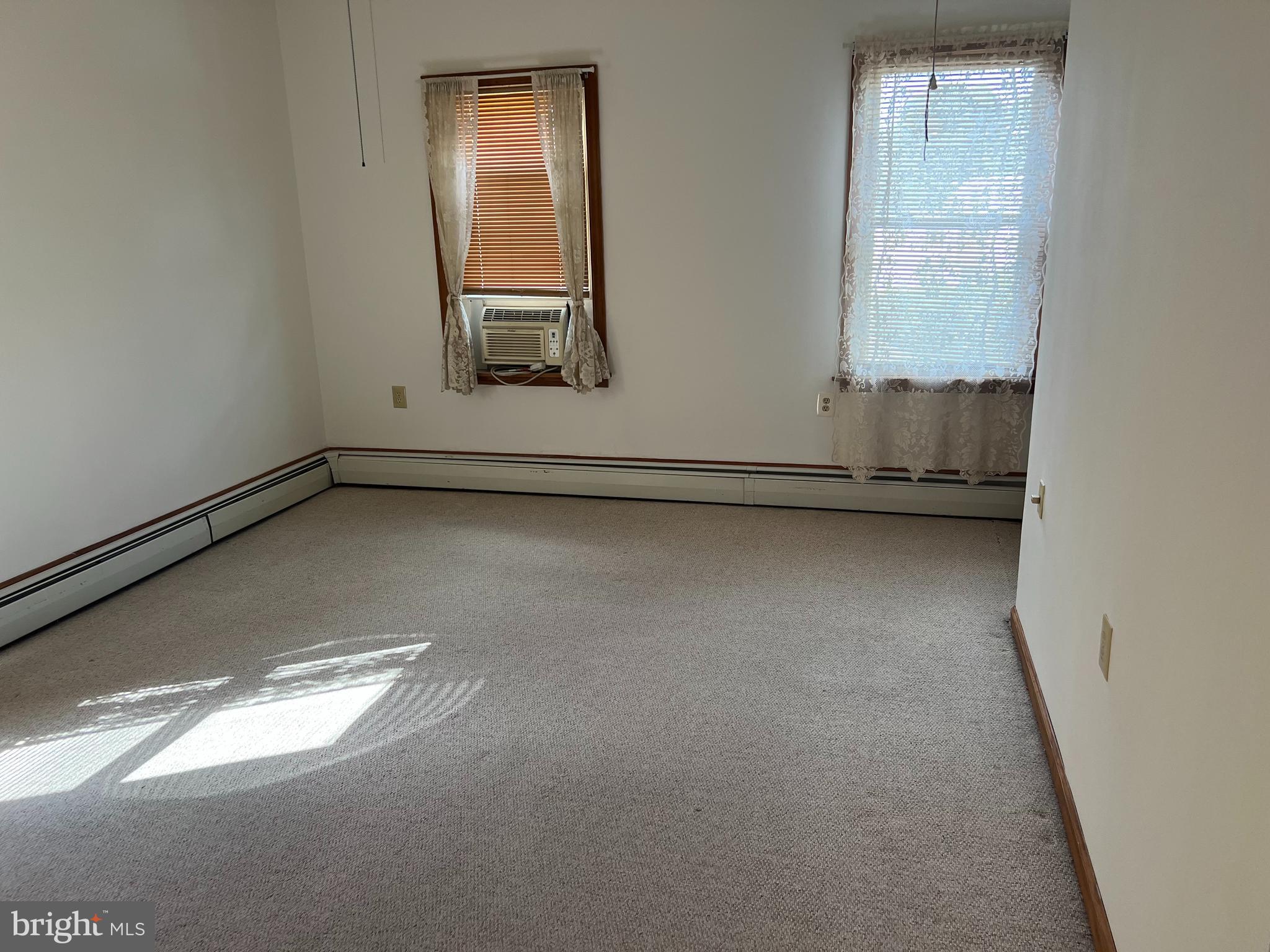 132 Main Street Mantua, NJ 08051 - Photo 3 of 15 an empty room with a window
