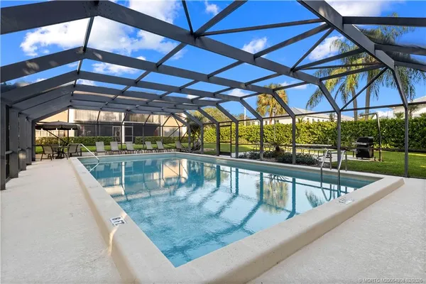 a view of a swimming pool with a patio