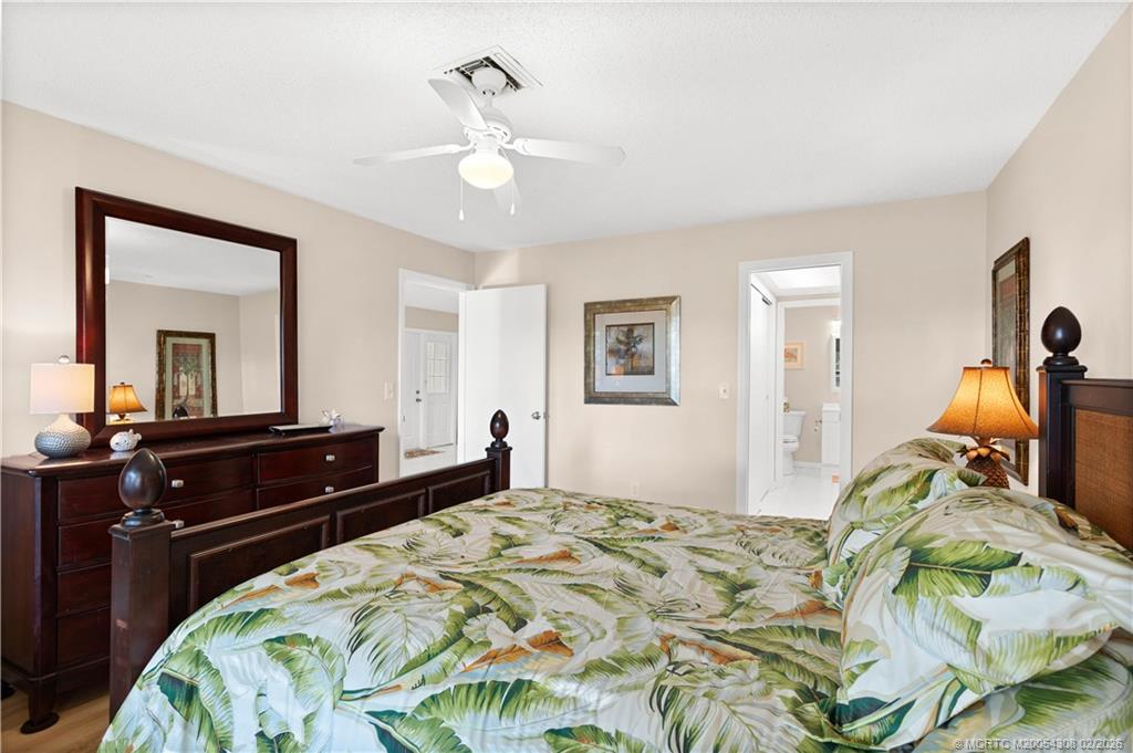 4885 Southeast Capstan Avenue, Unit 27 Stuart, FL 34997 - Photo 24 of 40 hallway to master bath has huge closets!