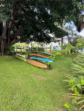 a view of a yard with swimming pool
