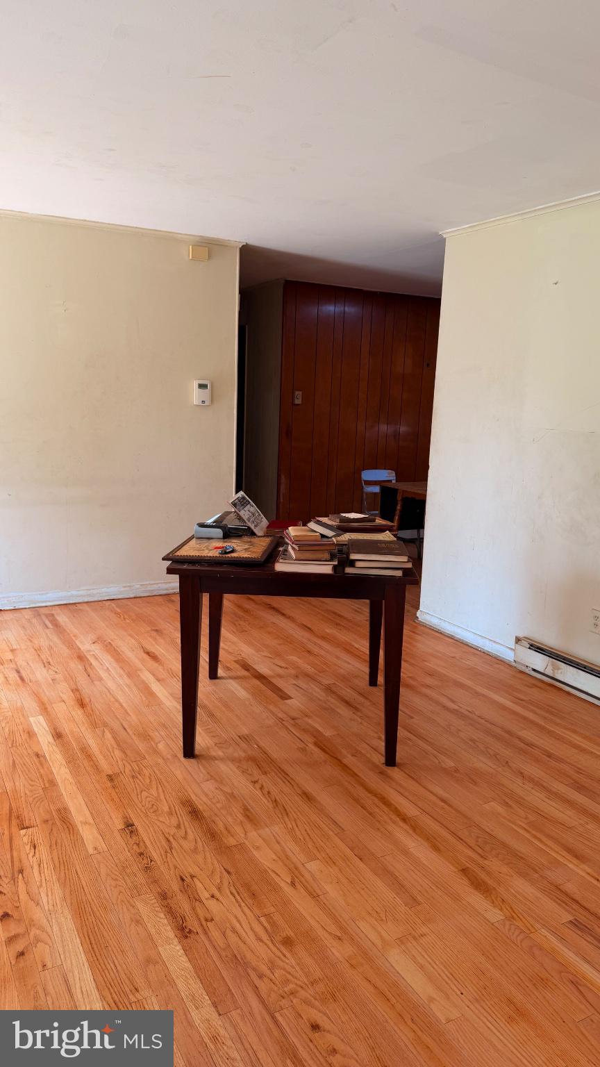 711 Rigby Avenue Cambridge, MD 21613 - Photo 12 of 21 Spacious room with warm wooden floors.