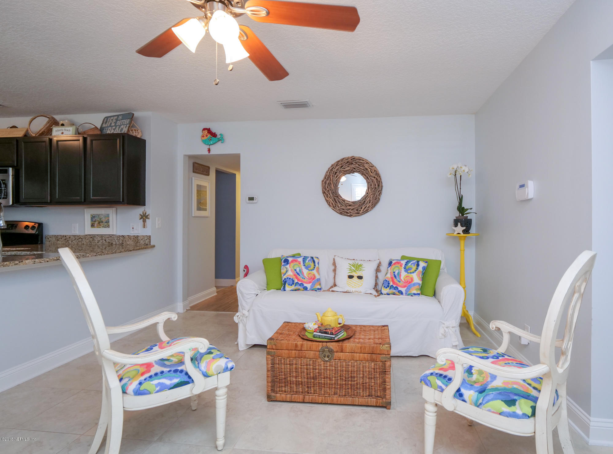 456 Irex Road Atlantic Beach, FL 32233 - Photo 11 of 29 a bedroom with a bed and a chandelier