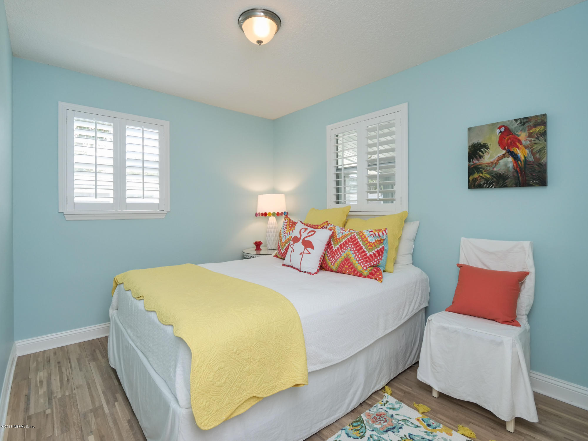 456 Irex Road Atlantic Beach, FL 32233 - Photo 17 of 29 a bedroom with a bed and dresser