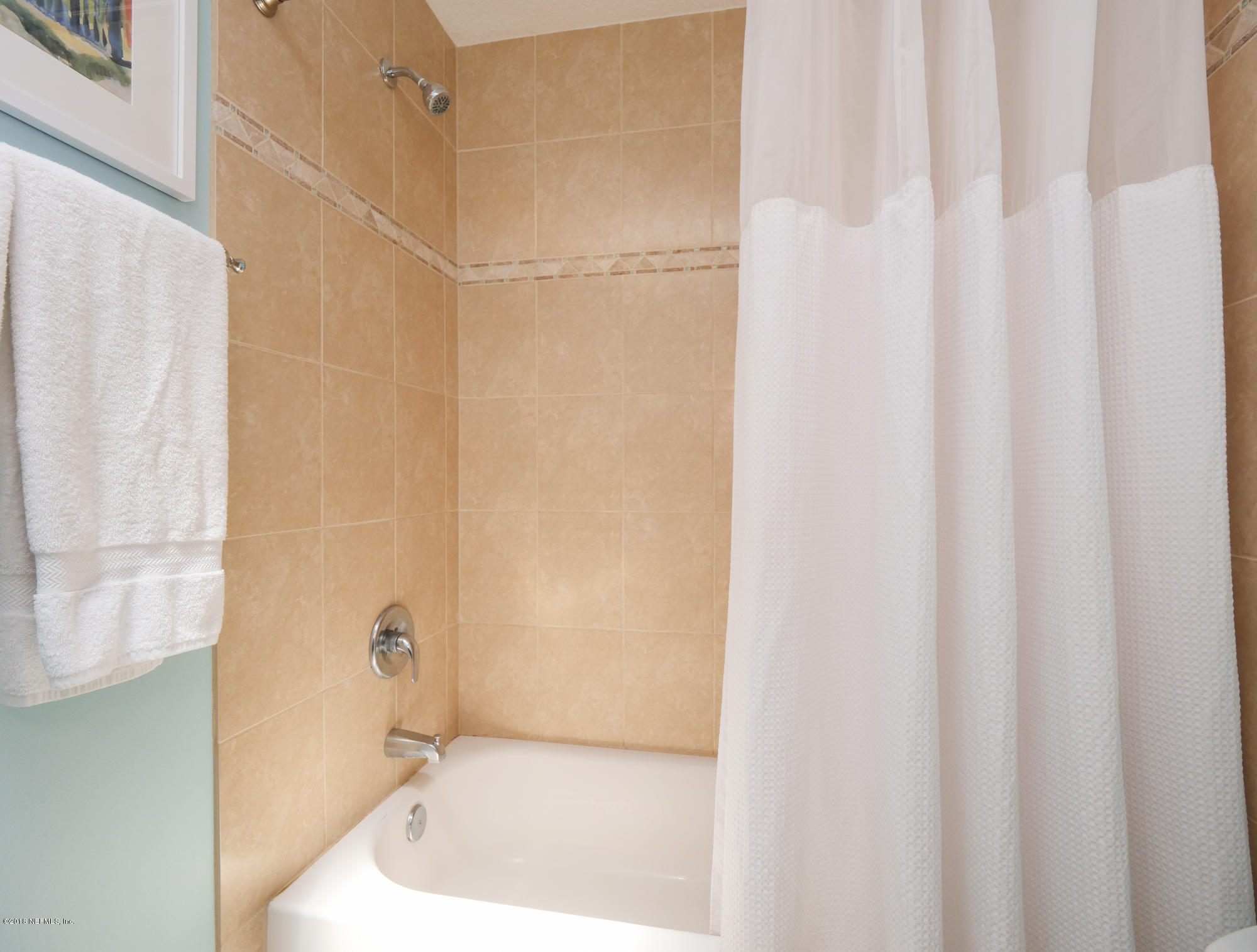 456 Irex Road Atlantic Beach, FL 32233 - Photo 19 of 29 a bathroom with a bathtub and a shower