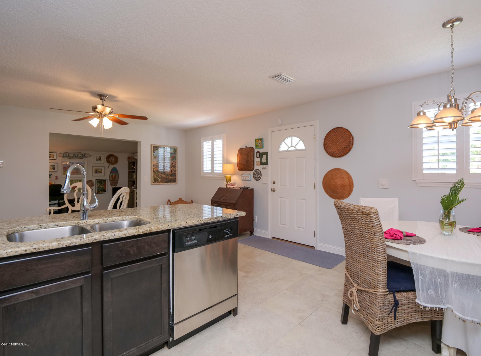 456 Irex Road Atlantic Beach, FL 32233 - Photo 5 of 29 a kitchen with cabinets and window
