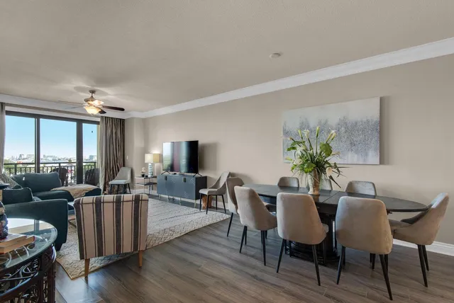a view of a dining room with furniture and wooden floor