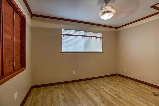 7801 Coldstream Drive Austin, TX 78748 - Photo 16 of 20 Unfurnished room with ornamental molding and light wood finished floors