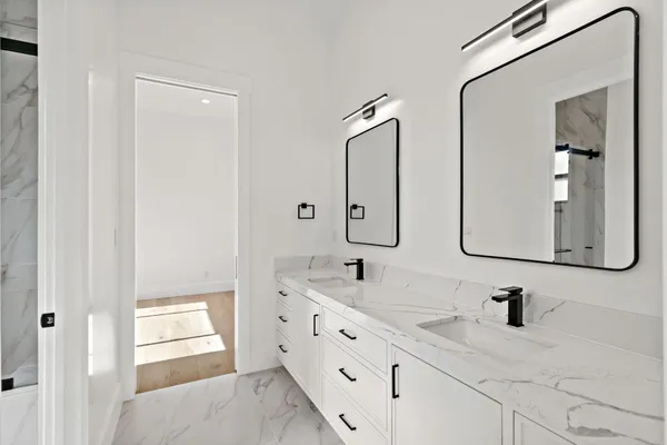 a view of a storage and utility room with washer and dryer