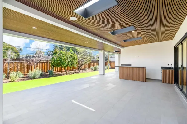 a view of an empty room with a yard