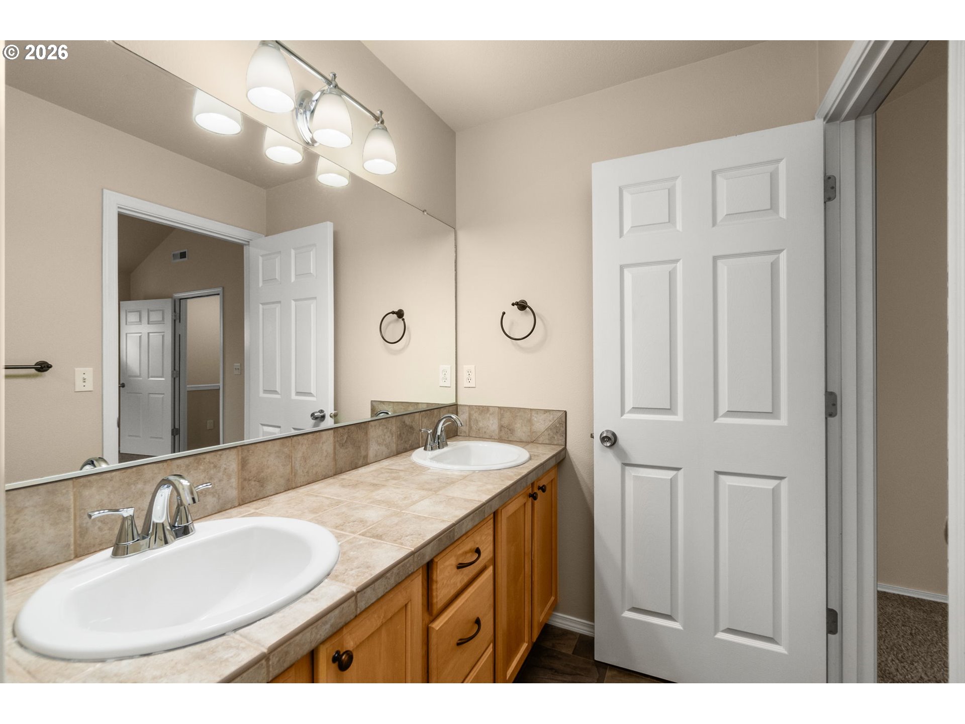 17428 Southwest September Lane Beaverton, OR 97003 - Photo 14 of 23 a bathroom with 2 sink and a mirror