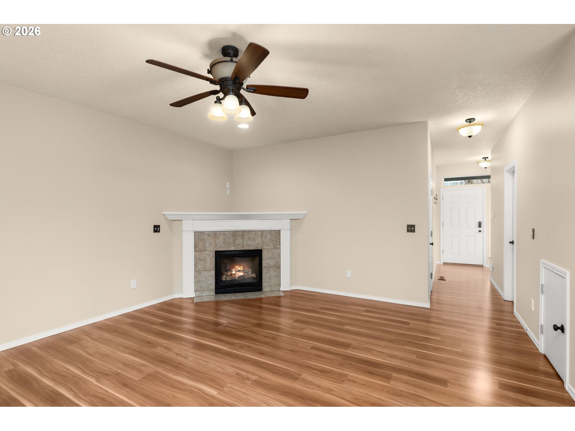 17428 Southwest September Lane Beaverton, OR 97003 - Photo 4 of 23 a view of an empty room and wooden floor