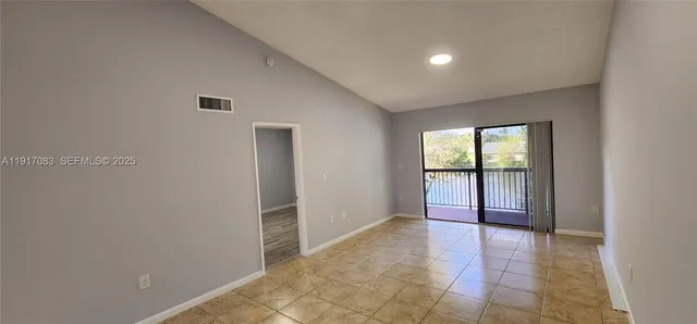 a view of an empty room with a window