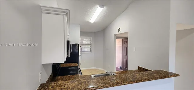 a view of a hallway view with staircase