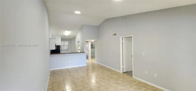 a view of a kitchen and a window