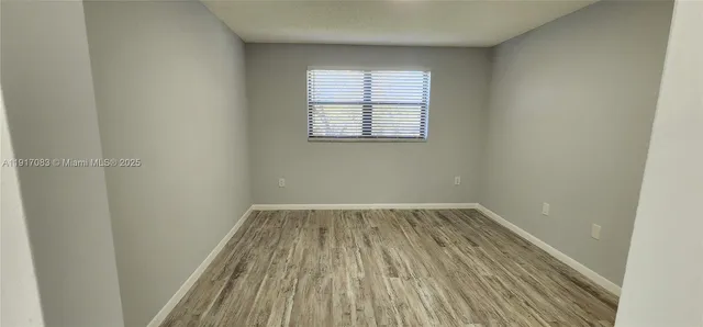 a kitchen with granite countertop a sink and a stove top oven