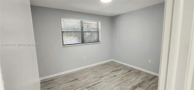 a view of a room that has a window in it