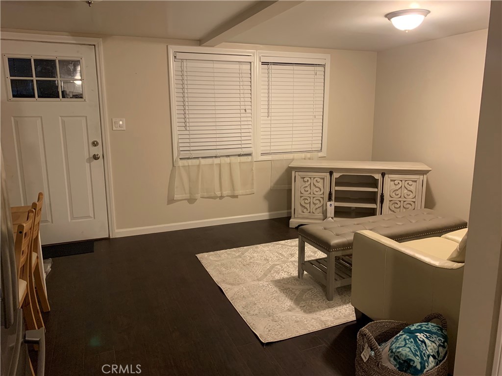 412 North Rose Avenue, Unit A Compton, CA 90221 - Photo 6 of 10 a living room with a couch and a window