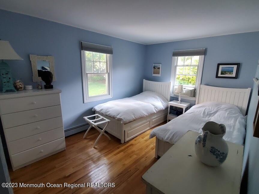 218 Bridge Avenue Point Pleasant Beach, NJ 08742 - Photo 12 of 19 a bedroom with a bed and a window