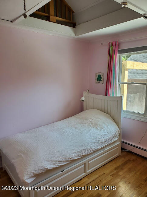 218 Bridge Avenue Point Pleasant Beach, NJ 08742 - Photo 13 of 19 a bed sitting in a bedroom next to a window