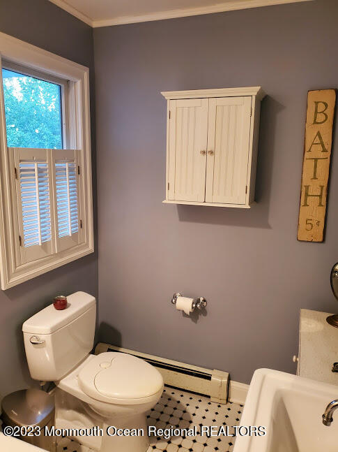 218 Bridge Avenue Point Pleasant Beach, NJ 08742 - Photo 14 of 19 a bathroom with a toilet sink and mirror