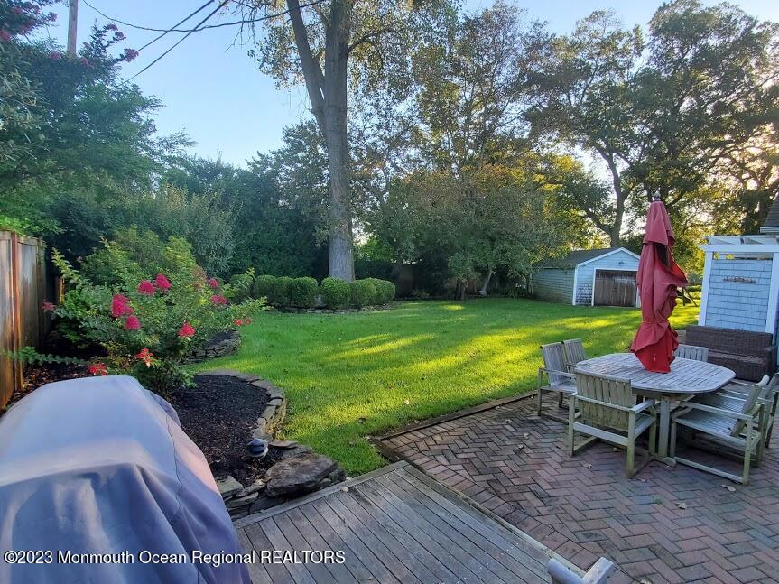 218 Bridge Avenue Point Pleasant Beach, NJ 08742 - Photo 18 of 19 a view of a chairs and table in the garden